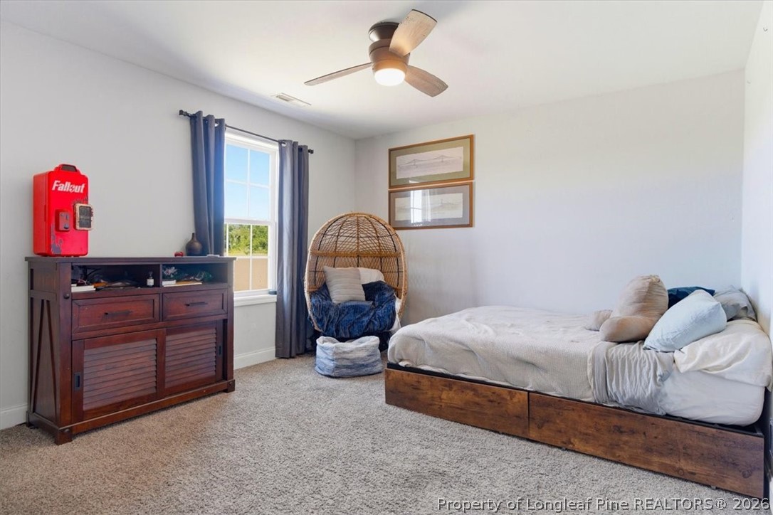 339 Rocking Horse Lane Raeford, NC 28376 - Photo 34 of 47 a bedroom with a bed and dresser