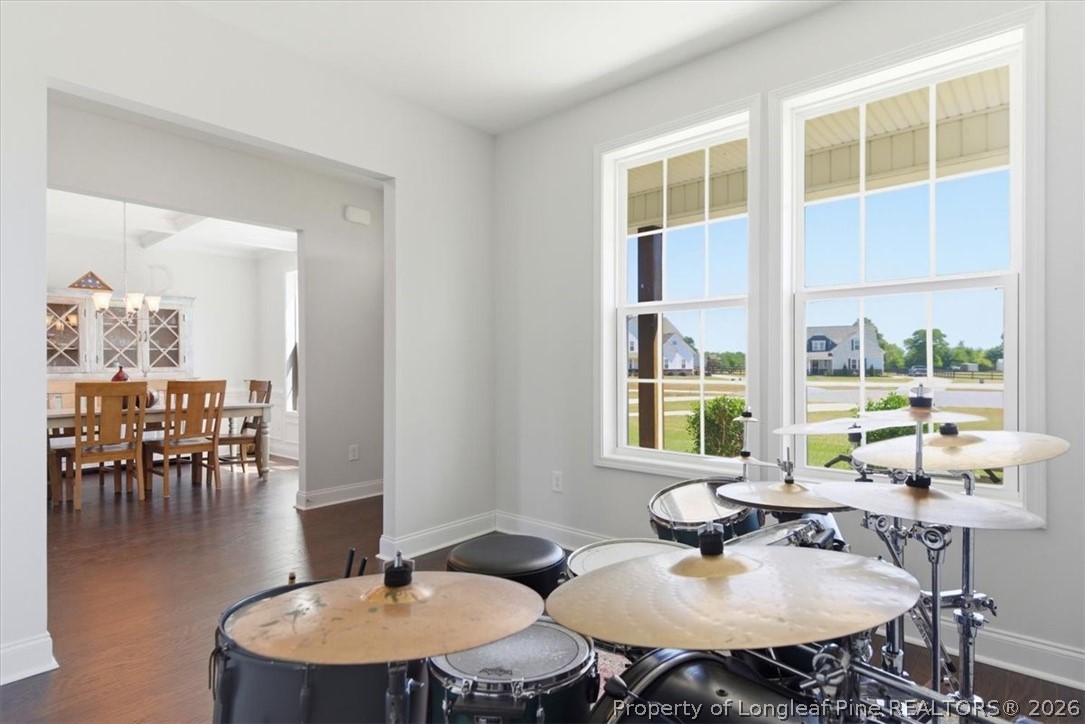 339 Rocking Horse Lane Raeford, NC 28376 - Photo 6 of 47 a dining room with furniture a floor to ceiling windows and a dining table