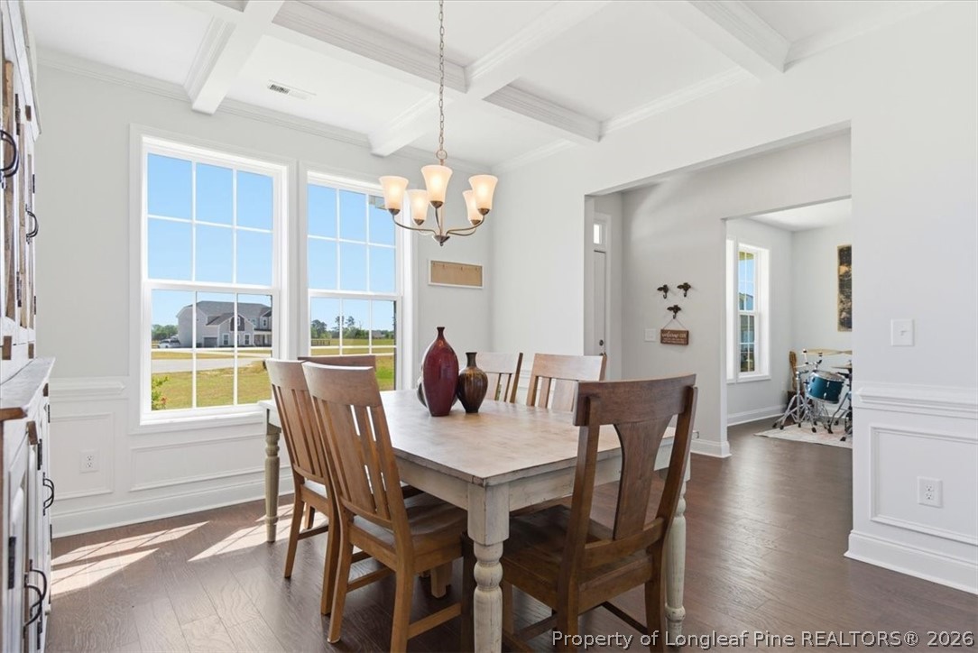 339 Rocking Horse Lane Raeford, NC 28376 - Photo 8 of 47 a view of a dining room with furniture window and wooden floor