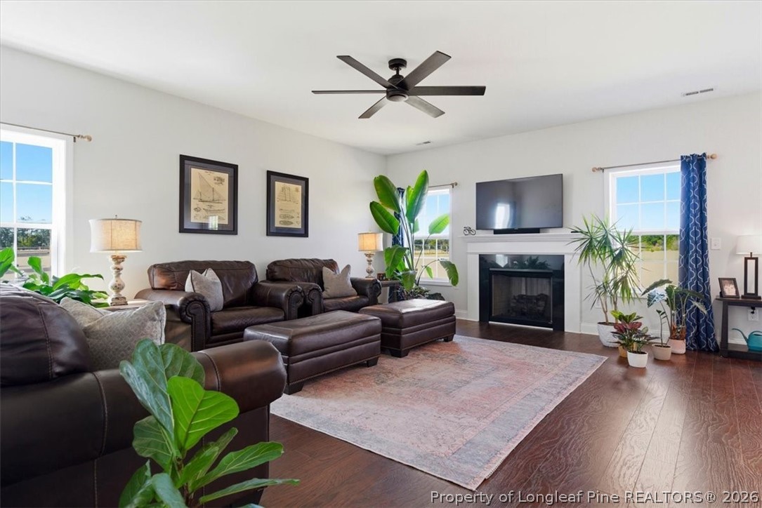 339 Rocking Horse Lane Raeford, NC 28376 - Photo 9 of 47 a living room with furniture a fireplace and a flat screen tv