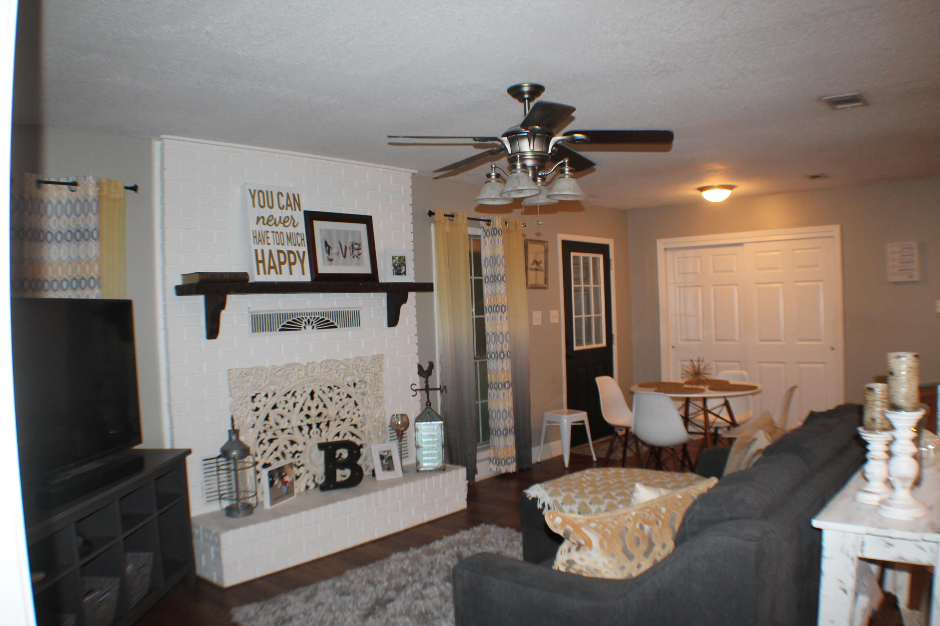 5843 Dairy Road Baker, FL 32531 - Photo 16 of 37 a living room with furniture and a fireplace