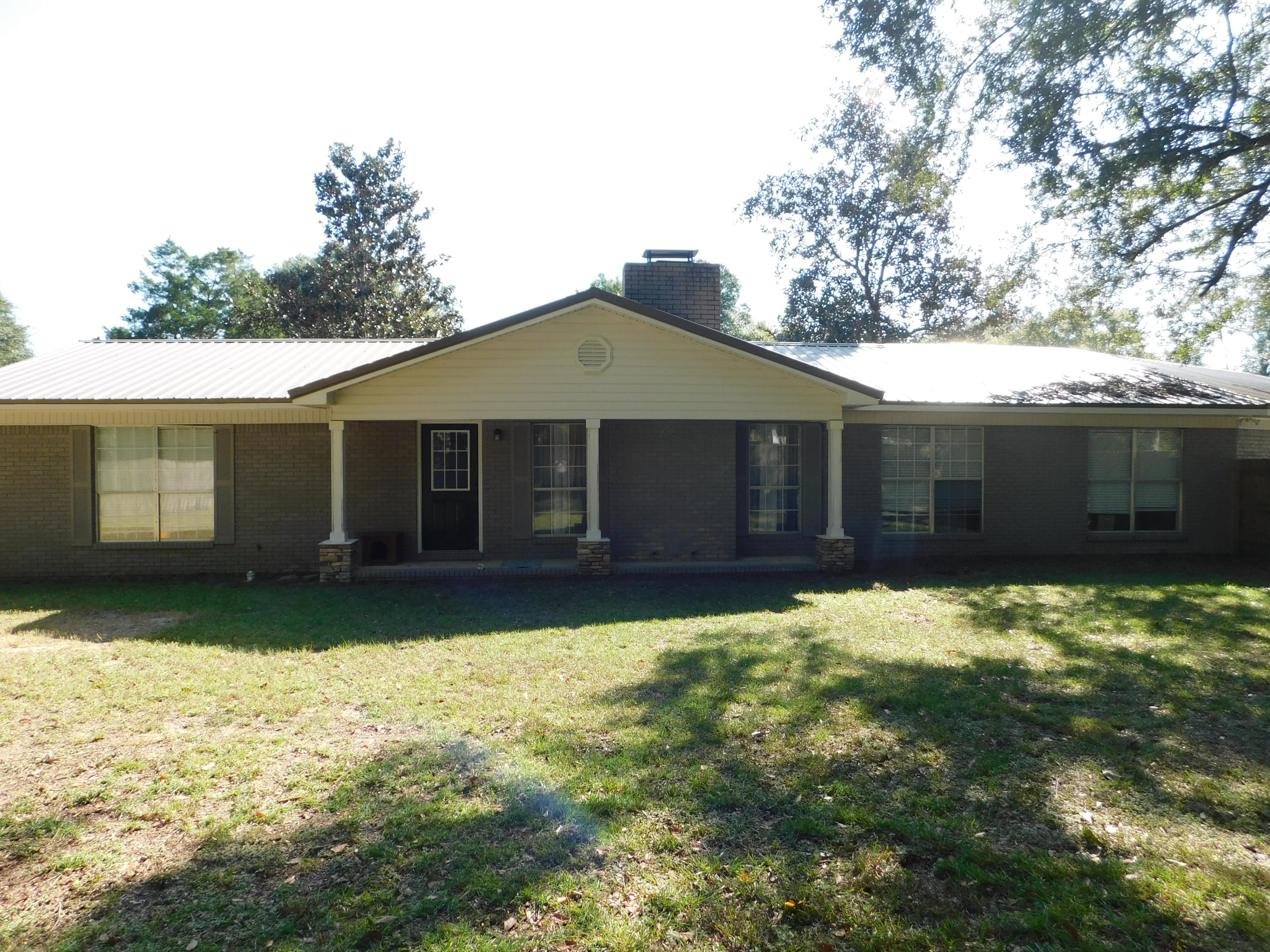 5843 Dairy Road Baker, FL 32531 - Photo 31 of 37 a front view of a house with a yard