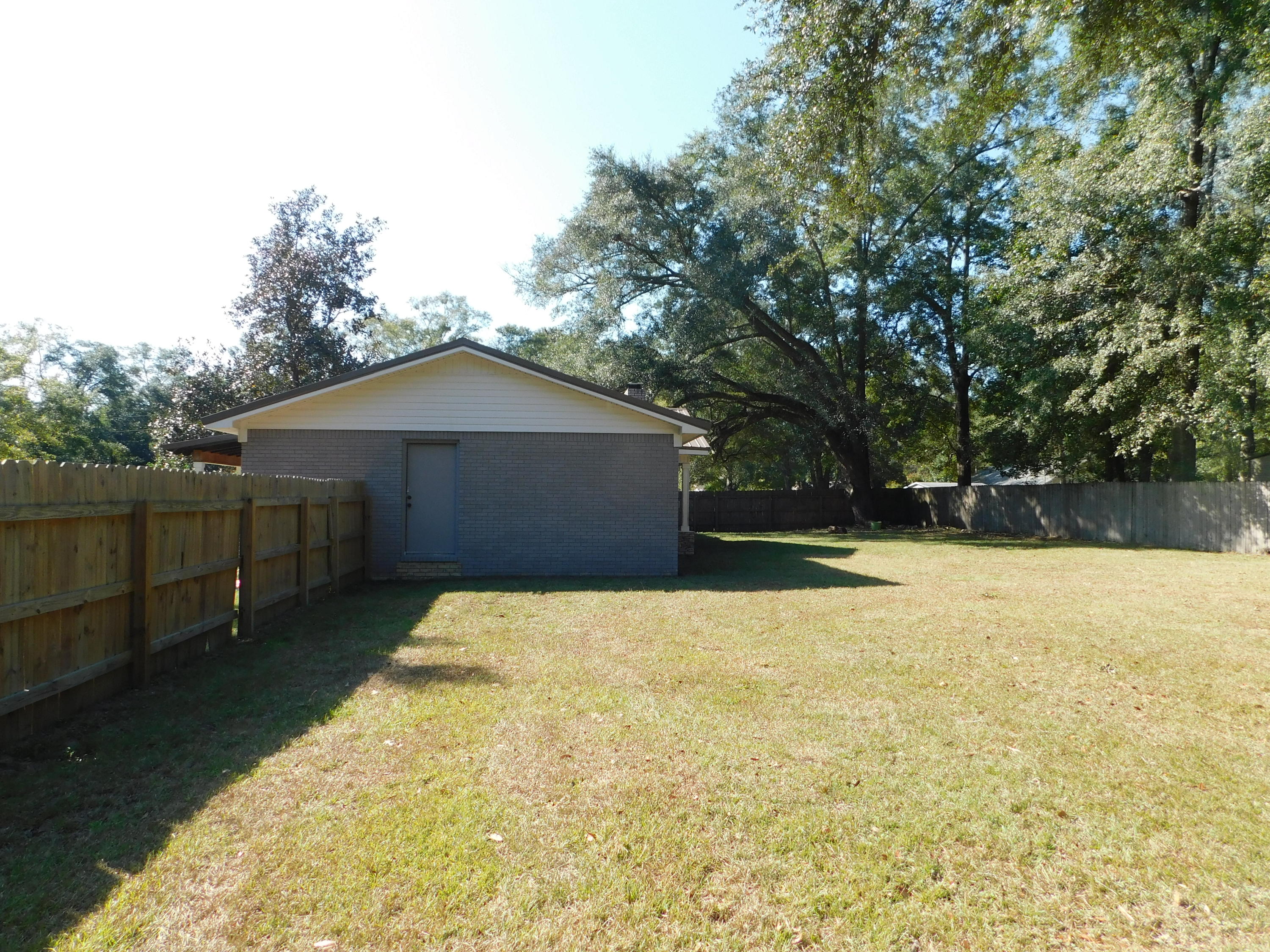 5843 Dairy Road Baker, FL 32531 - Photo 34 of 37 a house view with a outdoor space