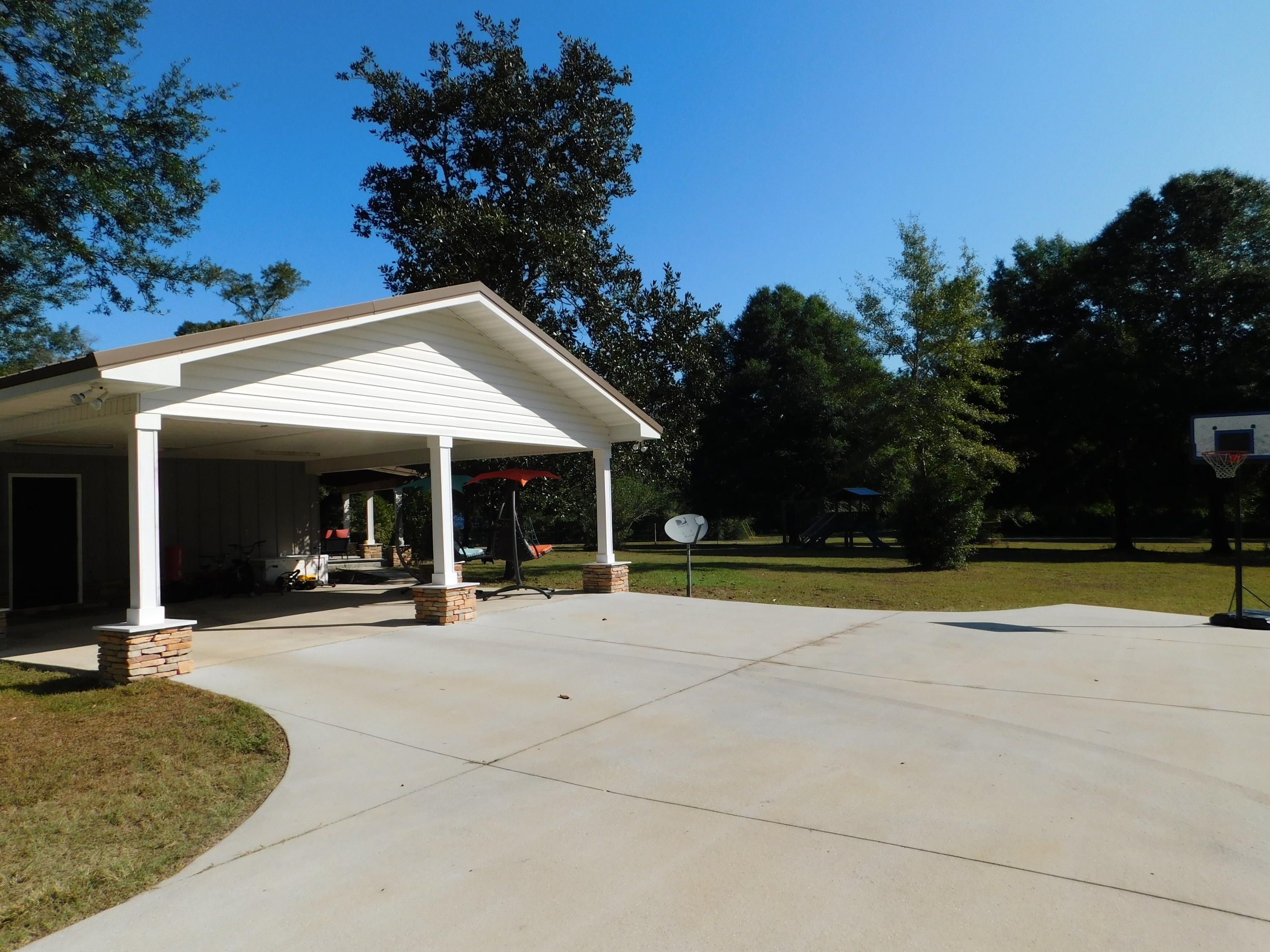5843 Dairy Road Baker, FL 32531 - Photo 5 of 37 a view of a house with outdoor space and porch