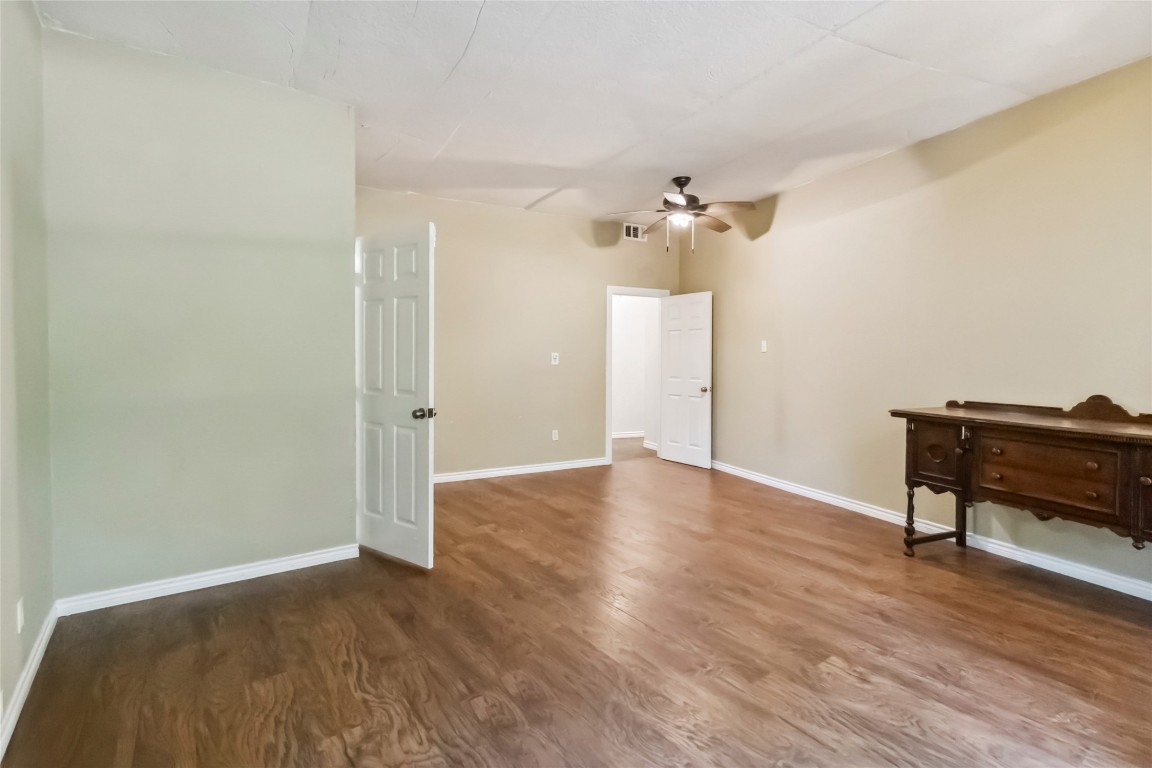 208 Old Potato Road Paige, TX 78659 - Photo 13 of 40 wooden floor in an empty room with a window