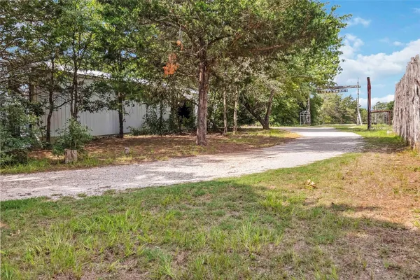 a view of a yard with a tree