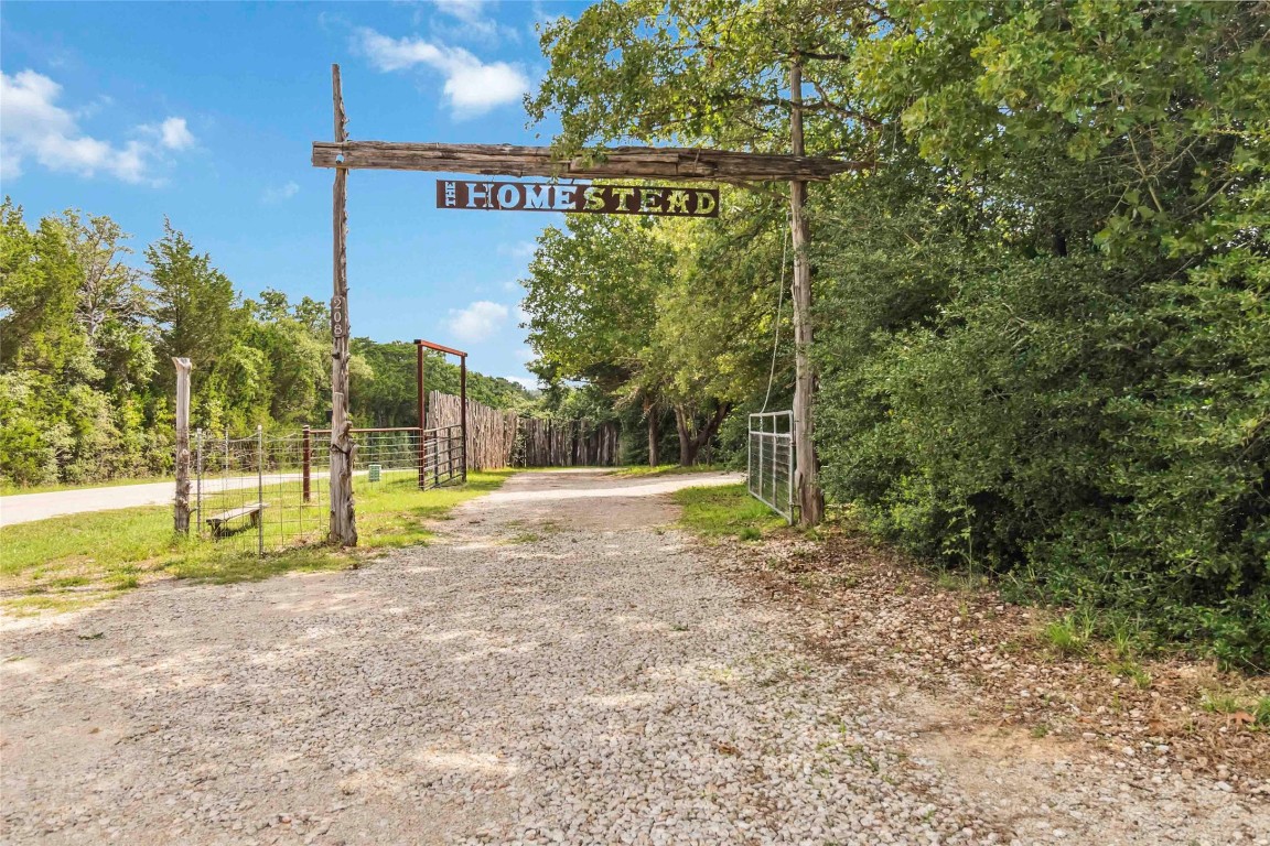 208 Old Potato Road Paige, TX 78659 - Photo 3 of 40 a view of a yard with swimming pool