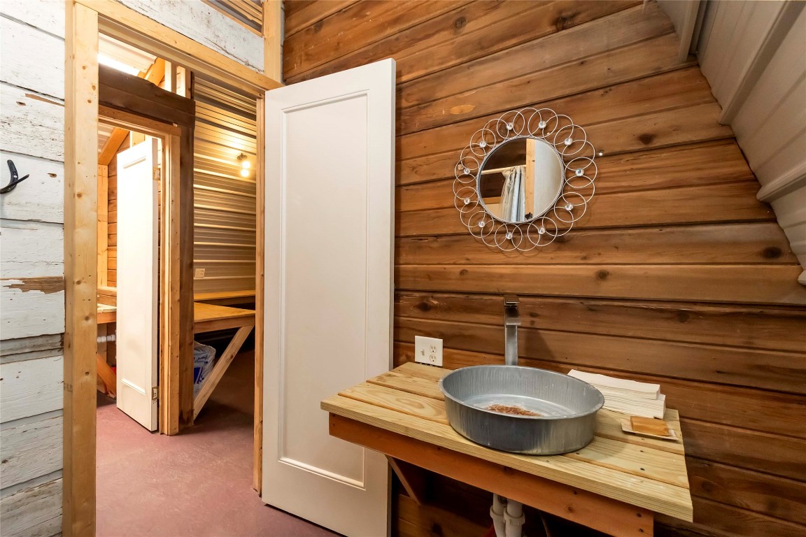 208 Old Potato Road Paige, TX 78659 - Photo 31 of 40 a bathroom with a sink and a mirror
