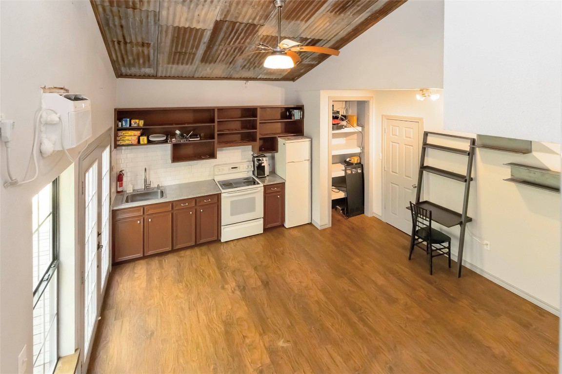 208 Old Potato Road Paige, TX 78659 - Photo 35 of 40 a view of a kitchen with furniture and a kitchen
