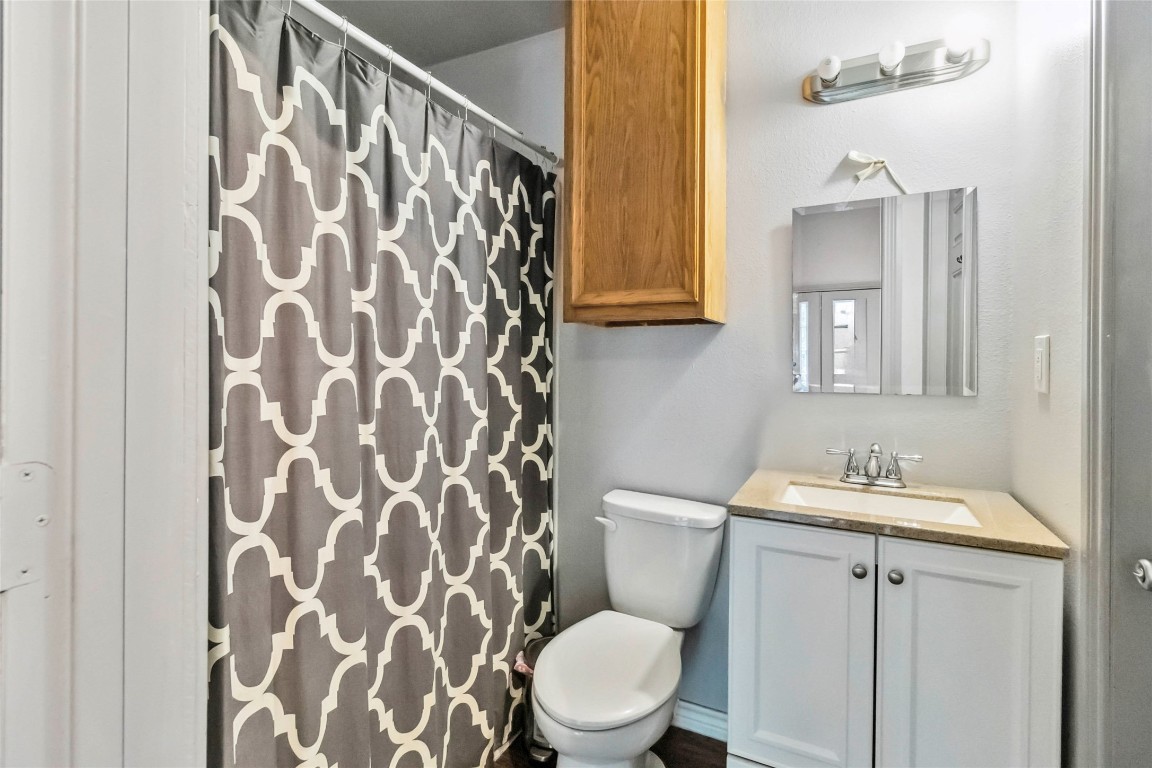 208 Old Potato Road Paige, TX 78659 - Photo 37 of 40 a bathroom with a sink and a toilet