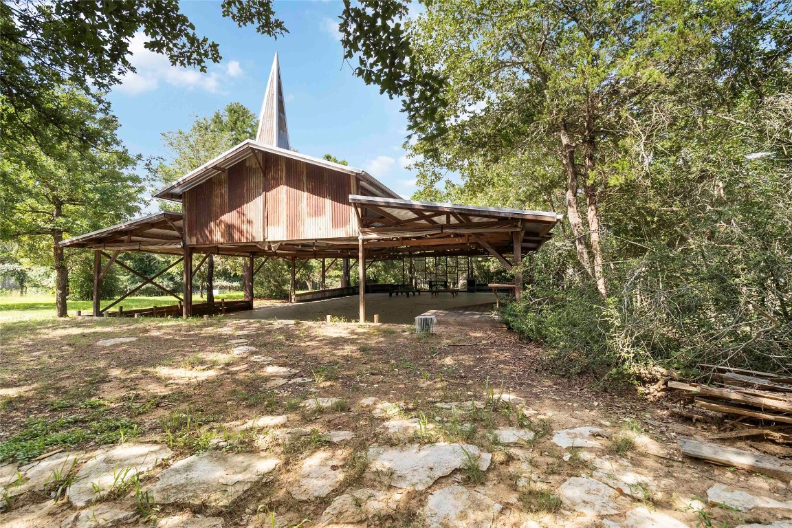 208 Old Potato Road Paige, TX 78659 - Photo 38 of 40 a backyard of a house with table and chairs