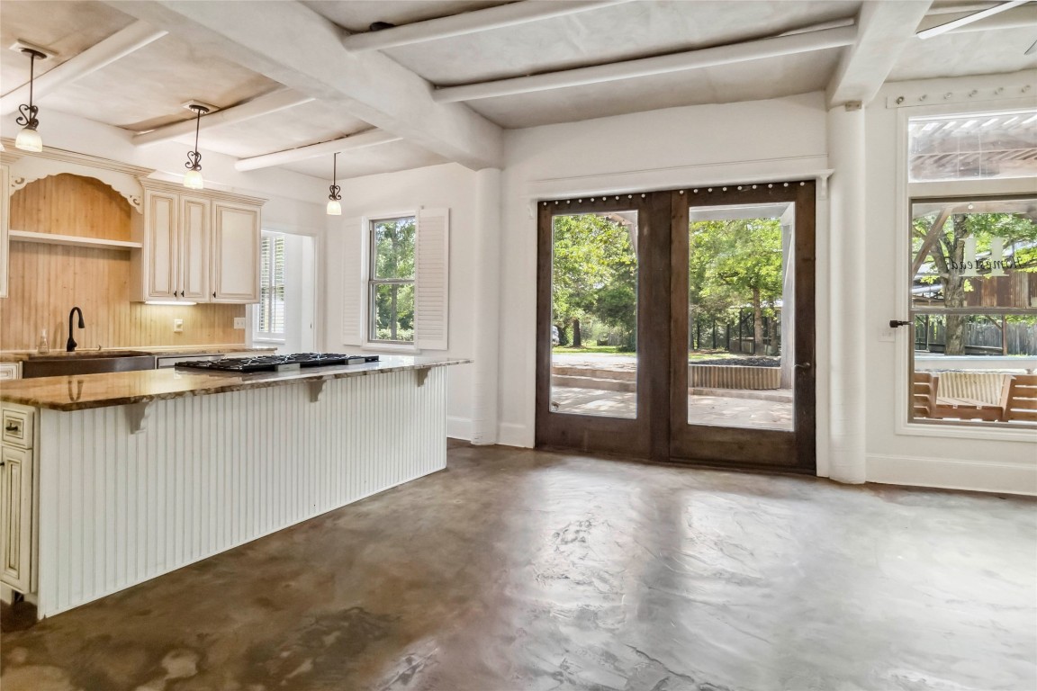208 Old Potato Road Paige, TX 78659 - Photo 7 of 40 a view of a kitchen with microwave and a sink