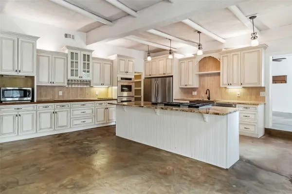 a large kitchen with cabinets