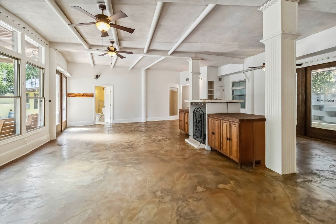 208 Old Potato Road Paige, TX 78659 - Photo 9 of 40 a view of a big room with a dining table & windows