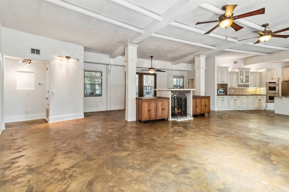 208 Old Potato Road Paige, TX 78659 - Photo 10 of 40 a view of a kitchen with refrigerator and windows
