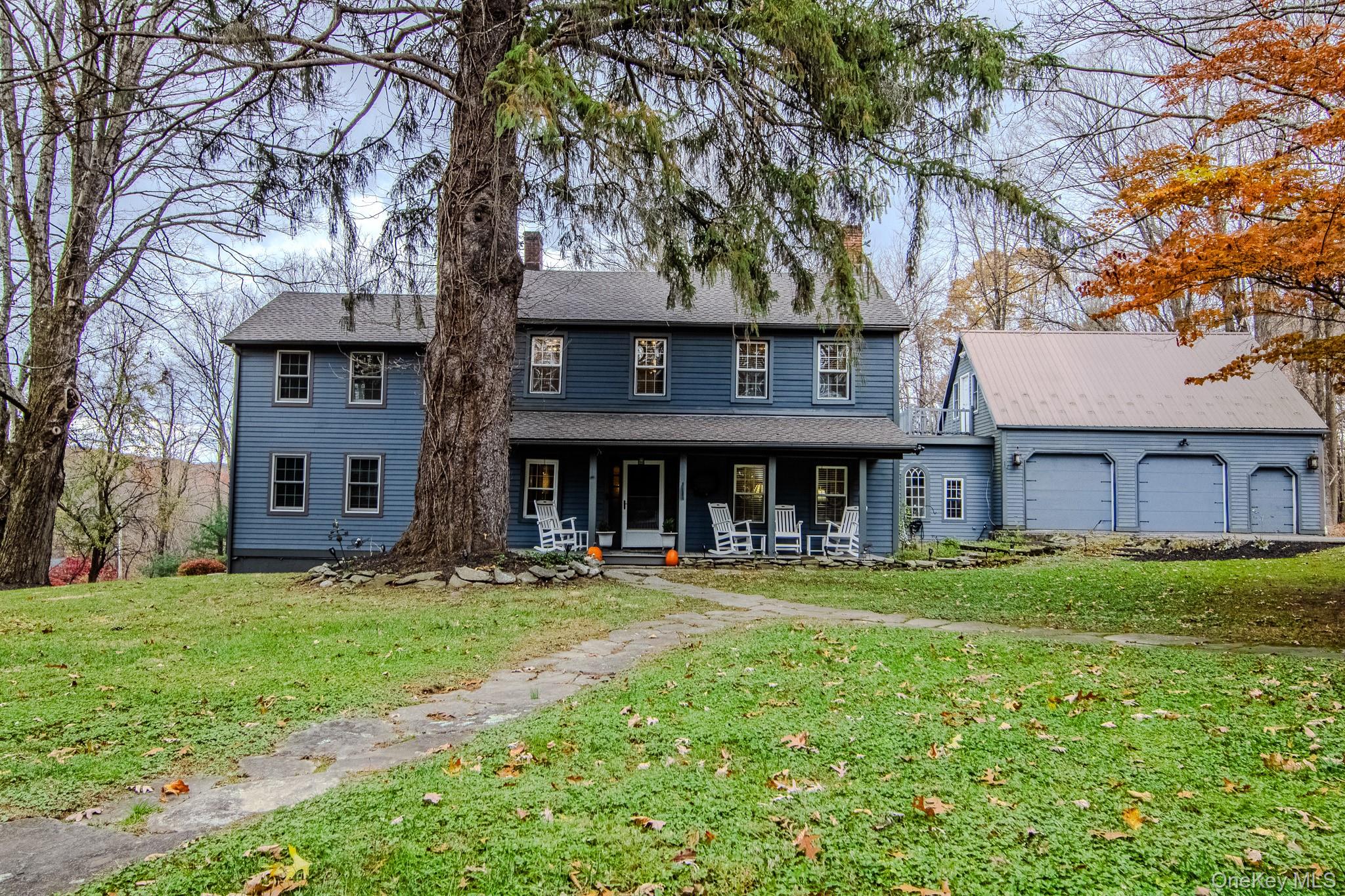 a front view of a building with a garden