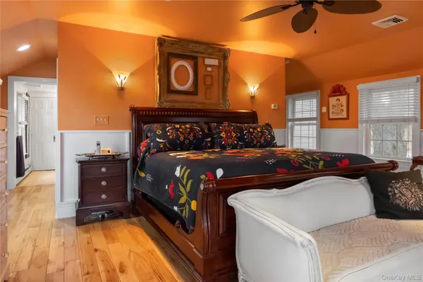 a bedroom with a bed and a fireplace