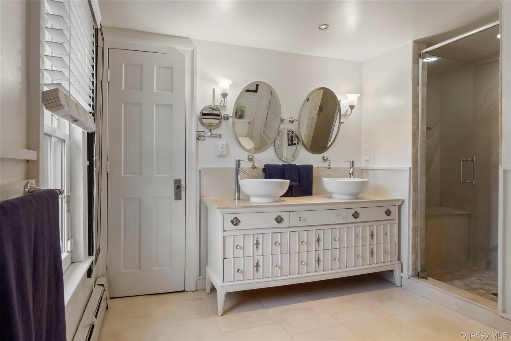 195 Pressler Road Wallkill, NY 12589 - Photo 34 of 45 a bathroom with a double vanity sink a mirror and shower