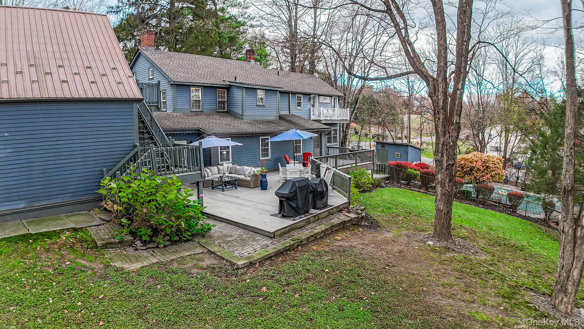 195 Pressler Road Wallkill, NY 12589 - Photo 37 of 45 a view of a house with a yard and sitting area