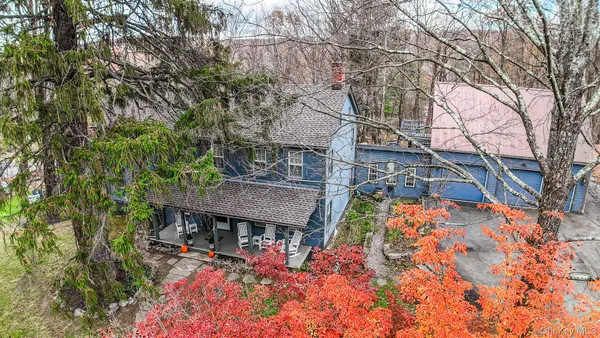front view of house with a trees