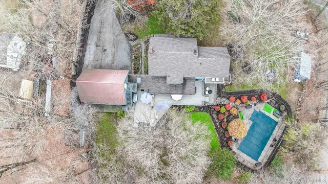 an aerial view of a house with garden space ocean view