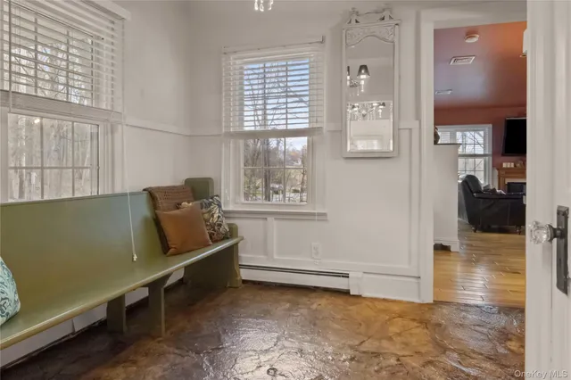 a view of a room with rack and windows