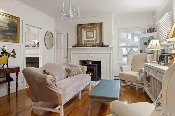 a living room with furniture fireplace and a flat screen tv