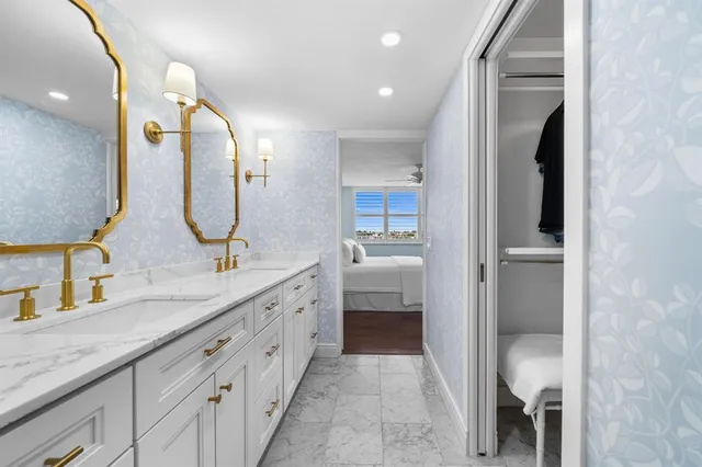 a bathroom with a double vanity sink and a mirror