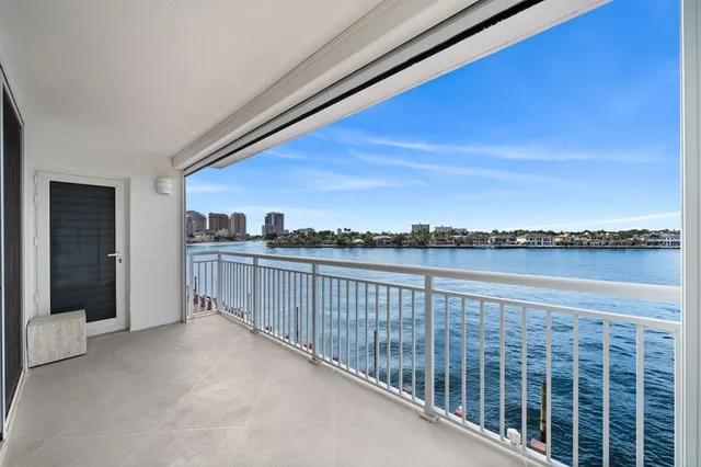 a view of a balcony with an outdoor seating