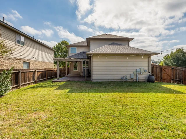 a view of a yard with a trampoline
