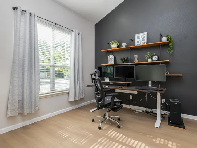 a workspace with furniture and a window
