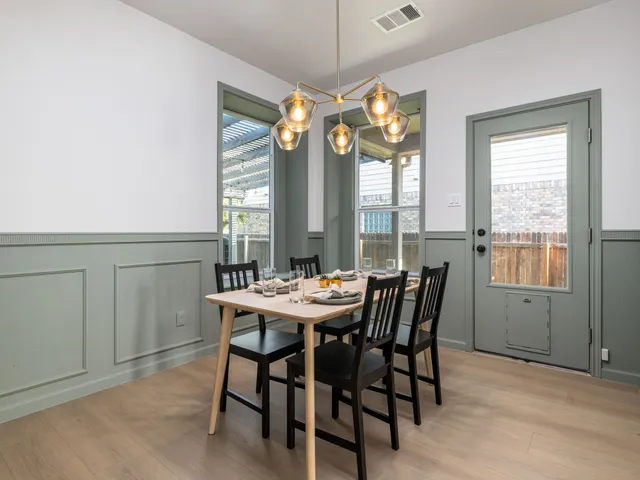 a view of a dining room with furniture window and outside view