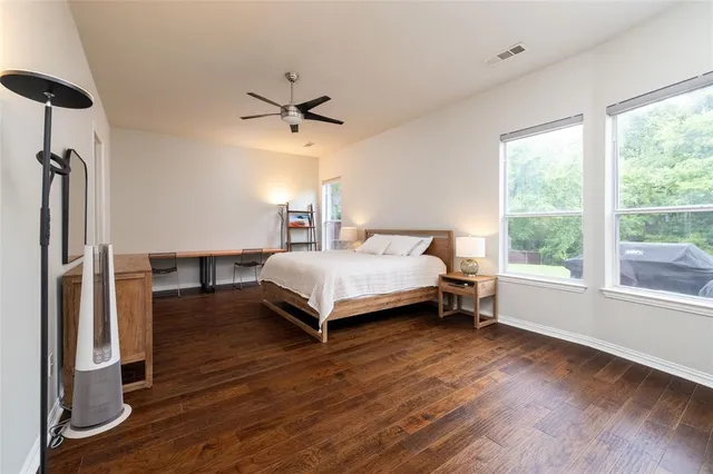 a bedroom with a bed closet and a window