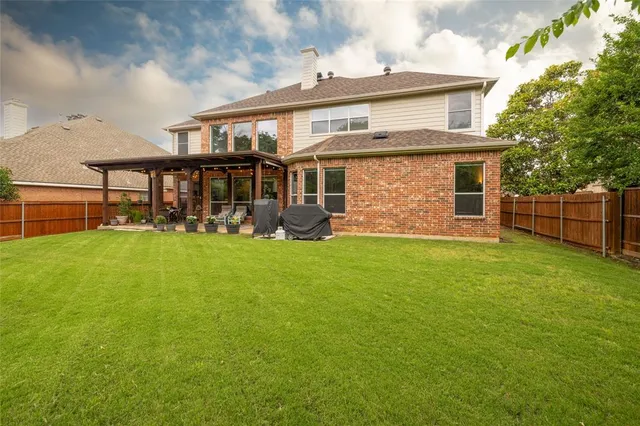 a view of a swimming pool with a yard