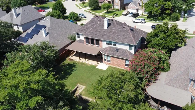 an aerial view of house with yard