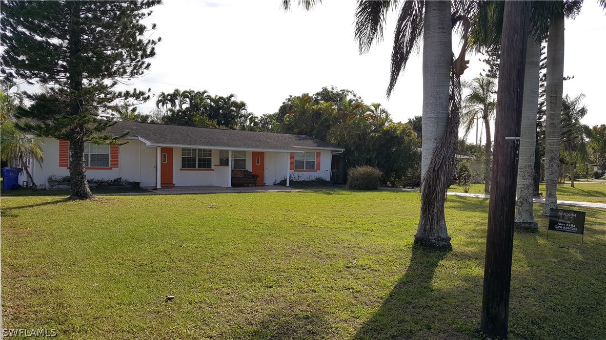 1924 Coronado Road Fort Myers, FL 33901 - Photo 1 of 11 a house view with swimming pool in front of it