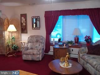 9 Applegate Road Jobstown, NJ 08041 - Photo 3 of 6 a living room with furniture and a fireplace