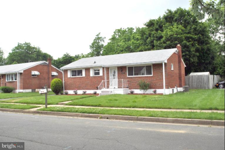2820 Greenlawn Road Baltimore, MD 21207 - Photo 11 of 26 a front view of a house with a yard