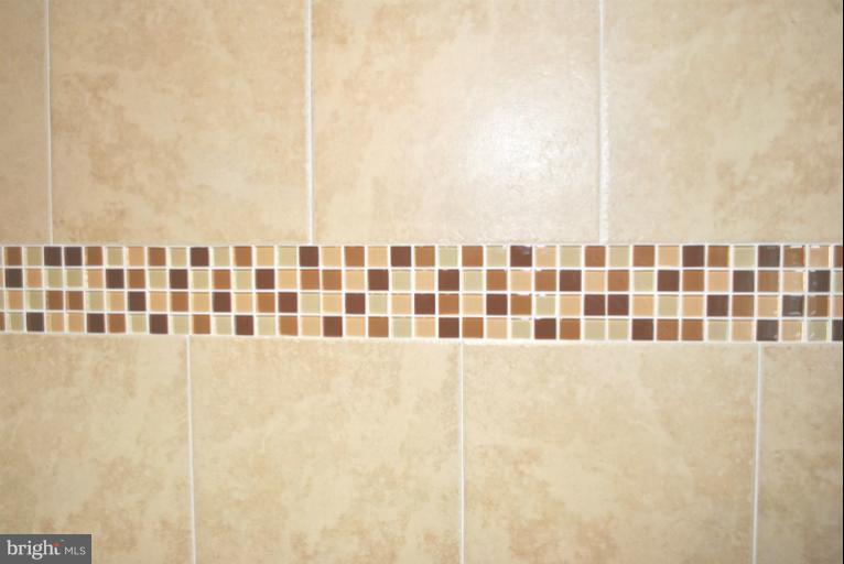 2820 Greenlawn Road Baltimore, MD 21207 - Photo 12 of 26 a bathroom with a bathtub and shower