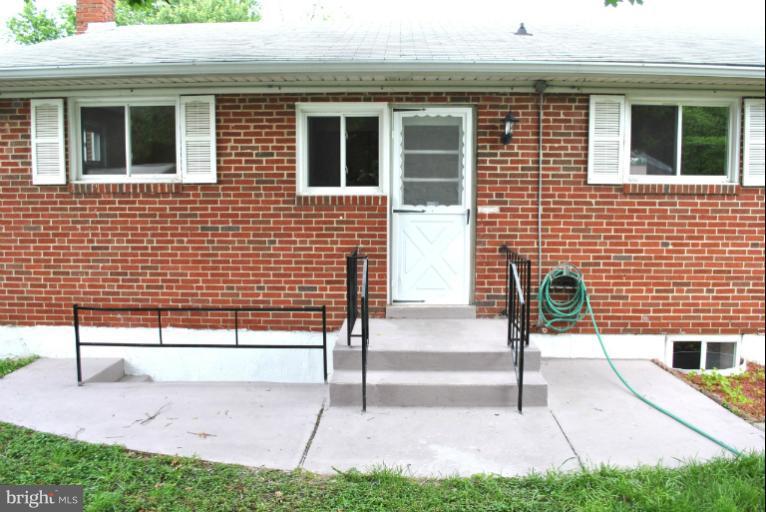 2820 Greenlawn Road Baltimore, MD 21207 - Photo 16 of 26 a view of front door of house with a yard