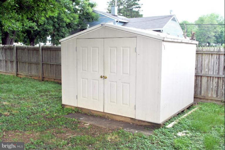 2820 Greenlawn Road Baltimore, MD 21207 - Photo 17 of 26 a view of backyard with small cabin and wooden fence