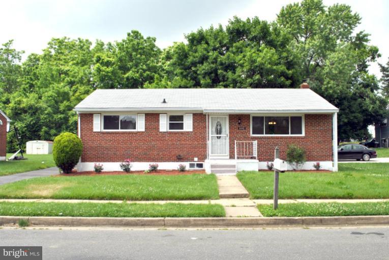 2820 Greenlawn Road Baltimore, MD 21207 - Photo 18 of 26 a front view of a house with a yard and garage
