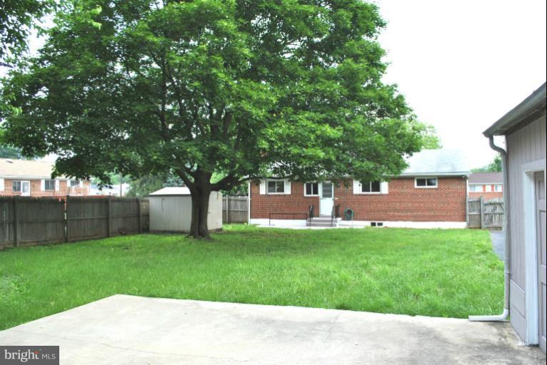 2820 Greenlawn Road Baltimore, MD 21207 - Photo 4 of 26 a view of a backyard with a garden
