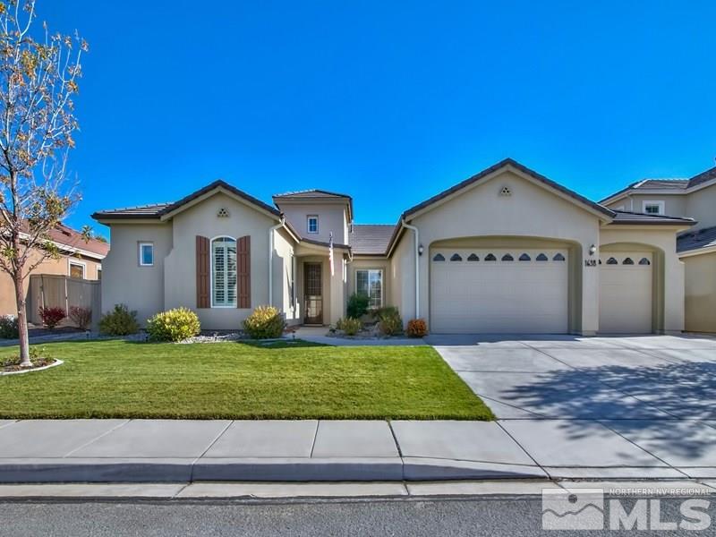 1638 Gemtown Drive Reno, NV 89521 - Photo 1 of 1 a front view of a house with a yard and garage