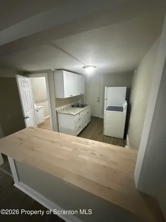 a bedroom with a bed and a large mirror in it