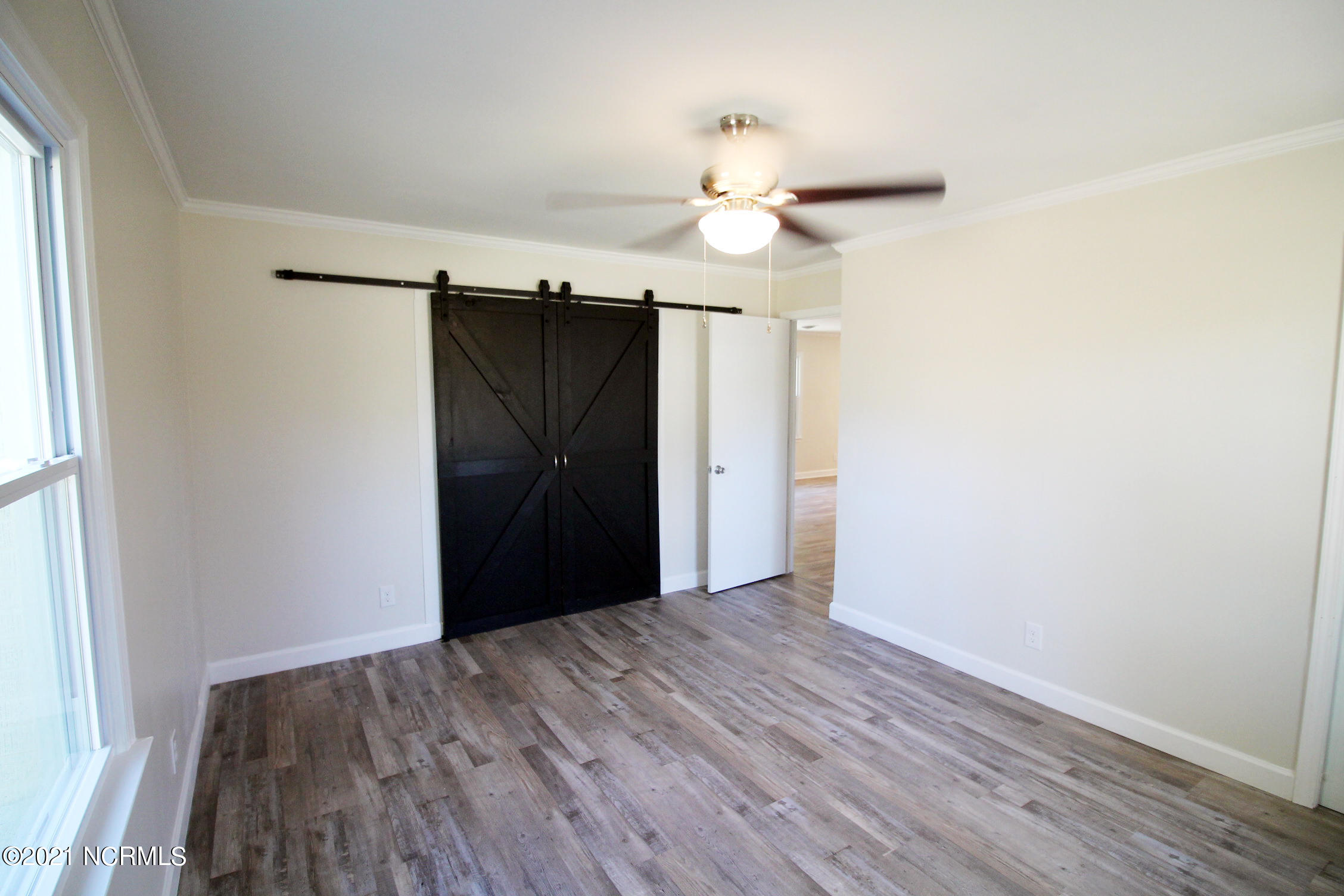 357 Pike Road Pantego, NC 27860 - Photo 8 of 24 MASTER BR WITH BARN DOORS TO CLOSET