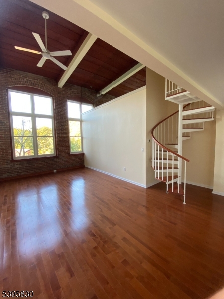 262 Main Street Little Falls, NJ 07424 - Photo 2 of 16 a view of an empty room with wooden floor and a window