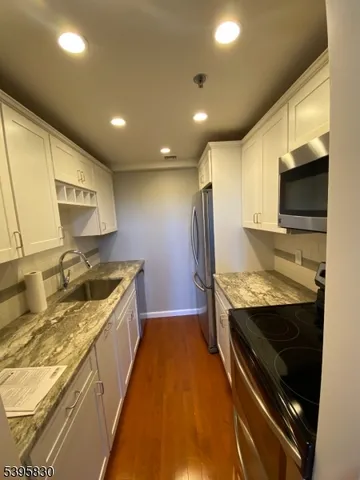 a kitchen with a stove and a sink