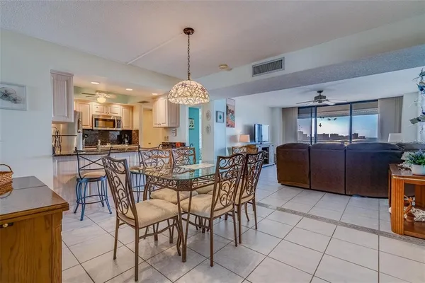 a kitchen with stainless steel appliances granite countertop a stove and a refrigerator