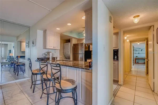 a kitchen with counter top space cabinets and appliances